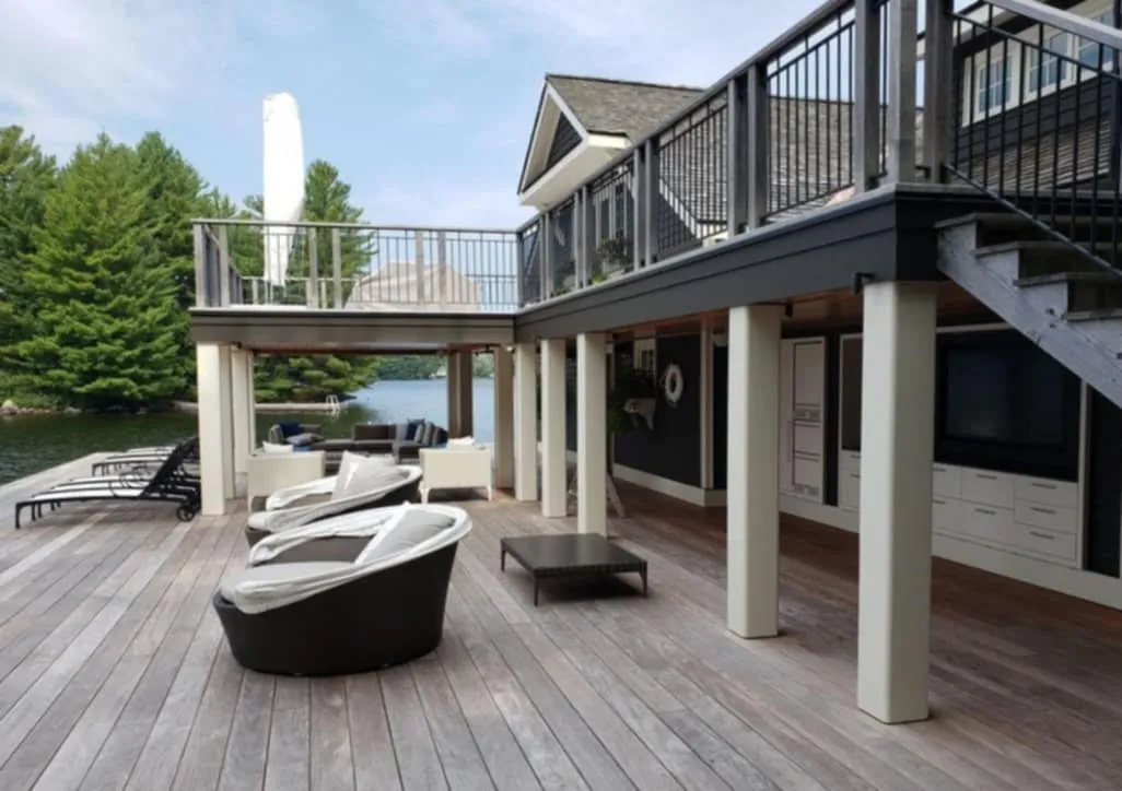 Timber-framed cottage under construction on a Muskoka shoreline